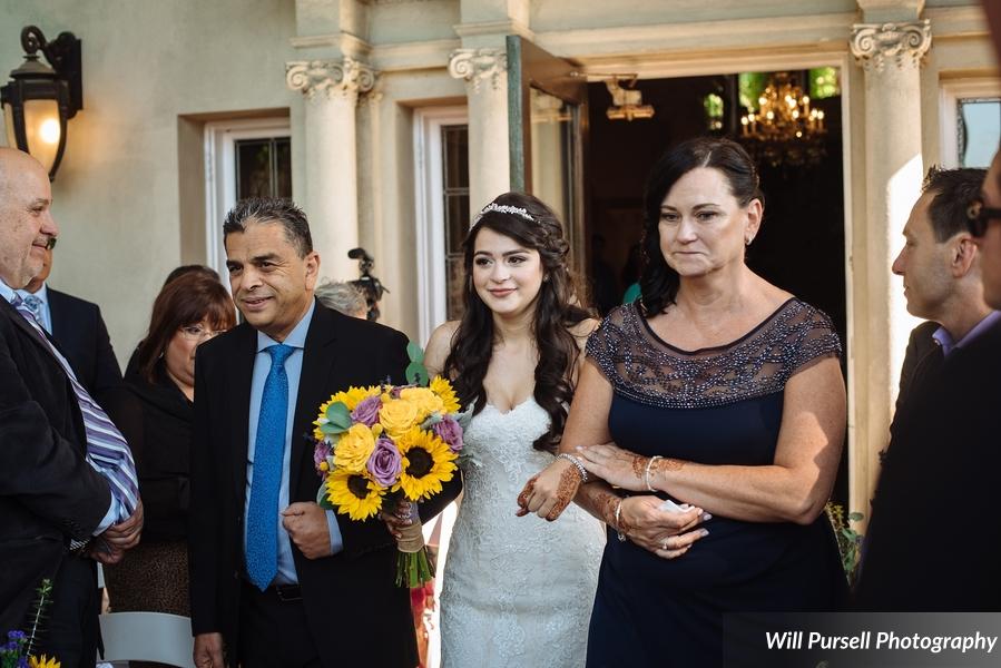 bride walking down the aisle with her parents, processional, giving away the bride