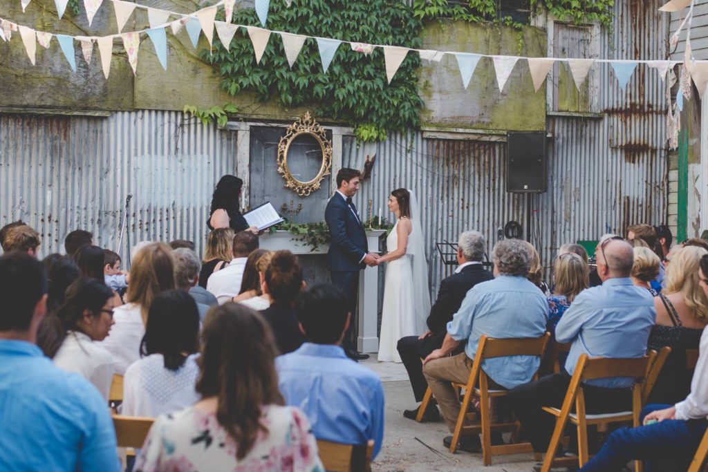 wedding ceremony in outdoor industrial space