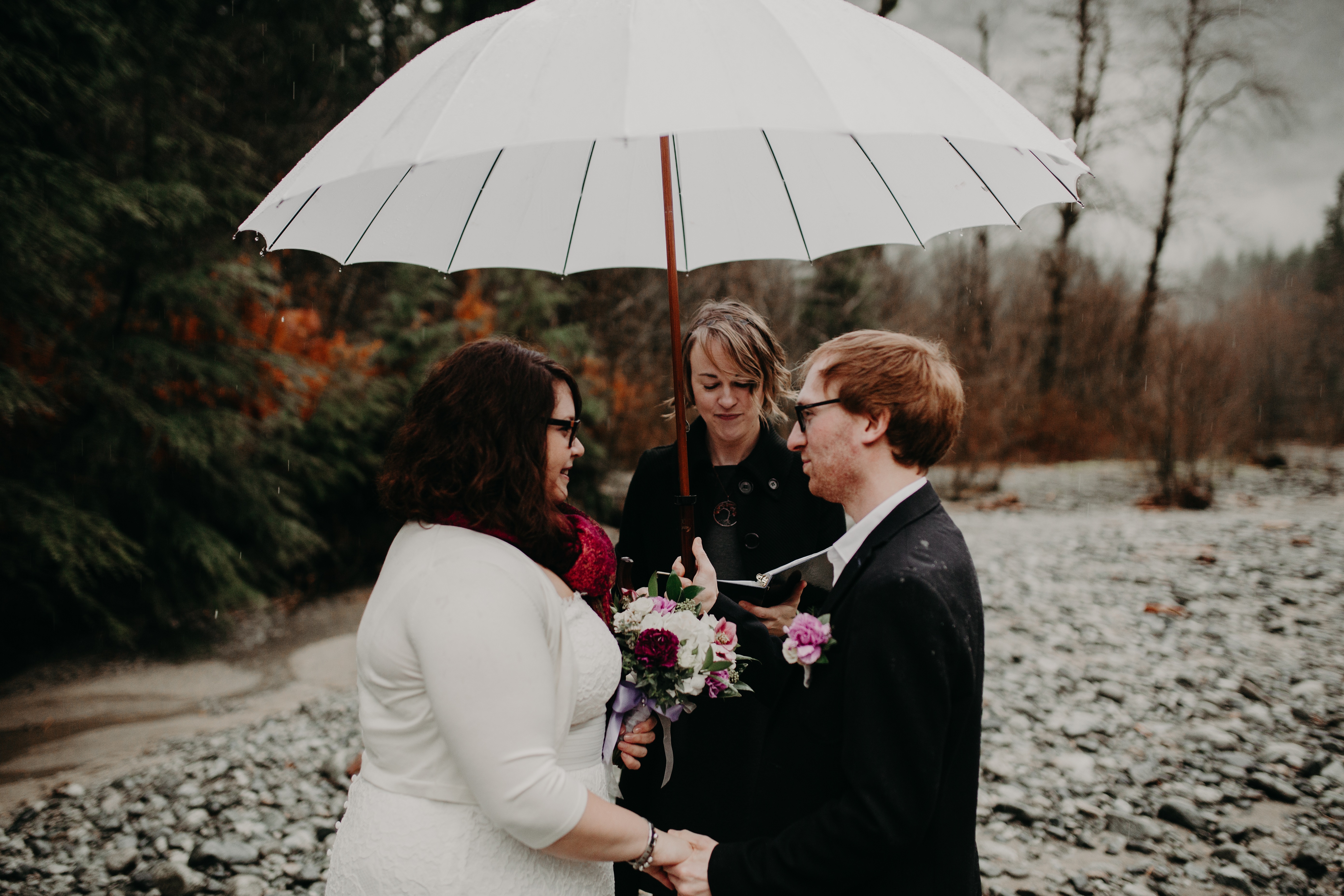 A wedding officiant leading an elopement ceremony