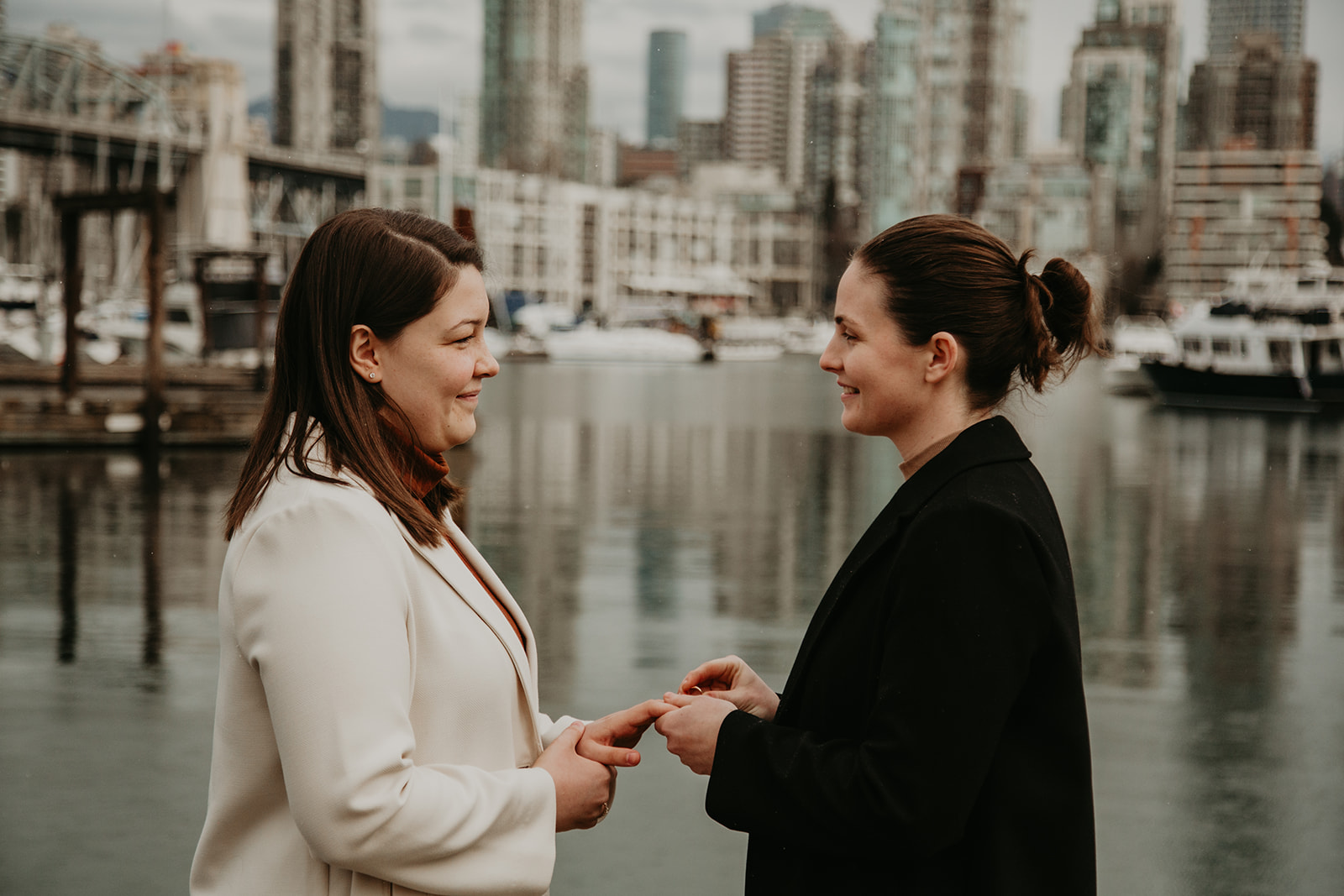 Couple exchanging vows by the marina in Vancouver, BC - How to change your name after marriage in BC