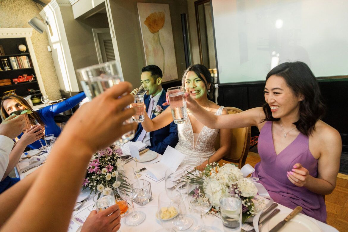wedding toast and wedding speech, wedding guests clinking glasses