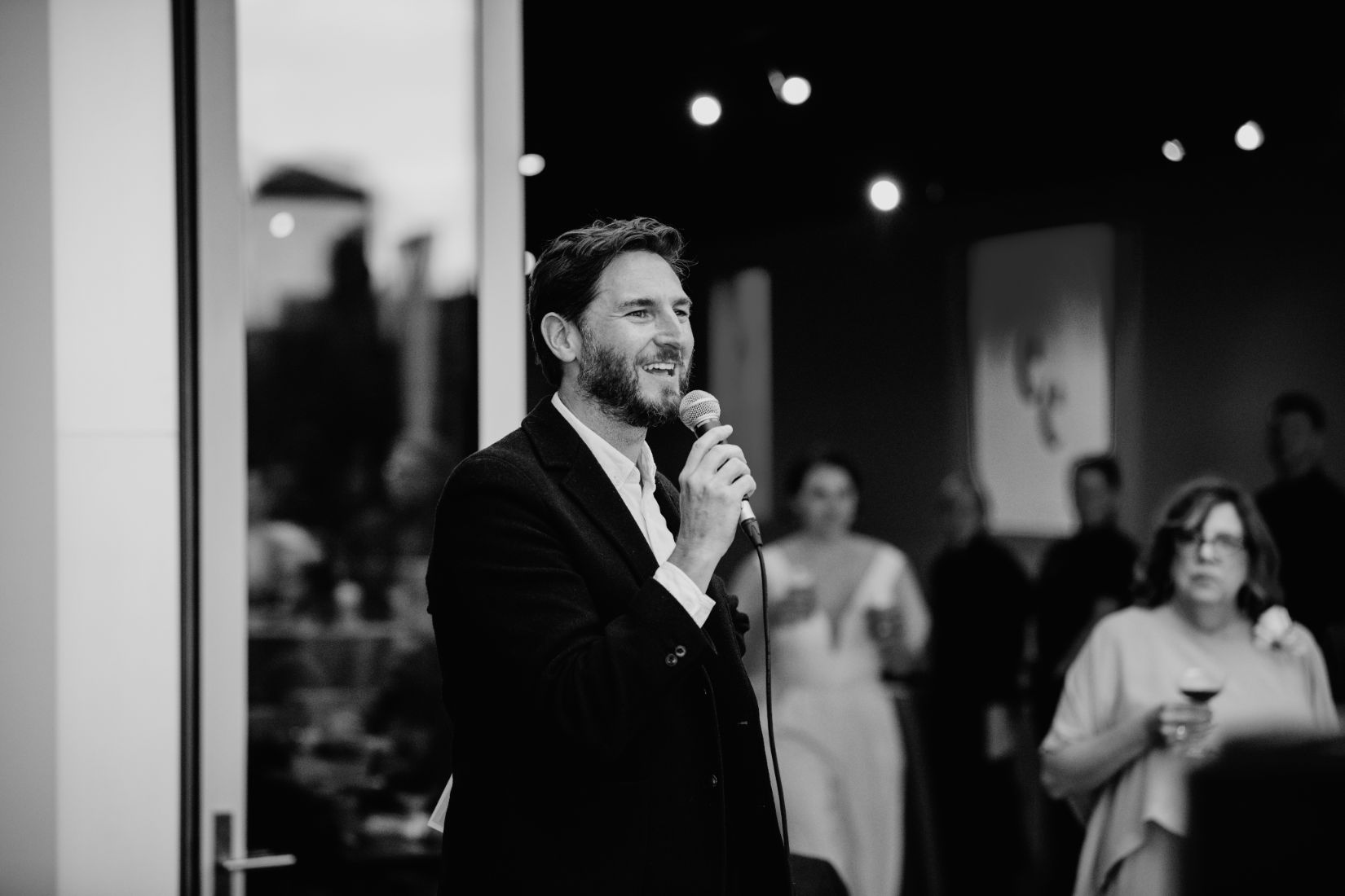 wedding toast given by wedding guest in black and white