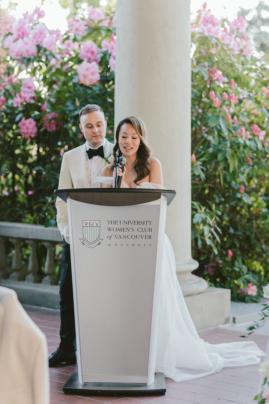 bride and groom giving a wedding speech at hycroft manor, vancouver wedding with young hip & married