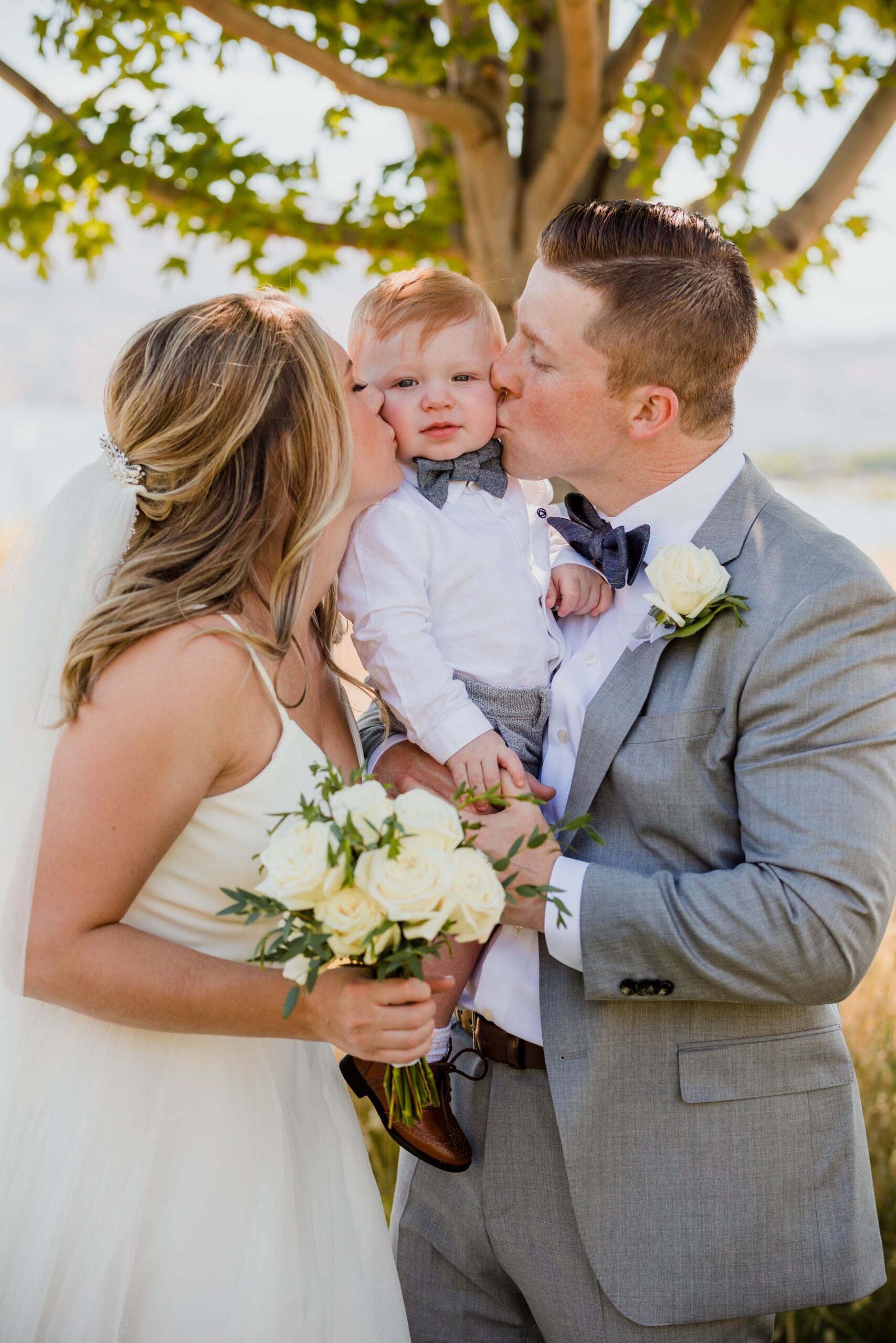 first kiss with baby boy at family wedding