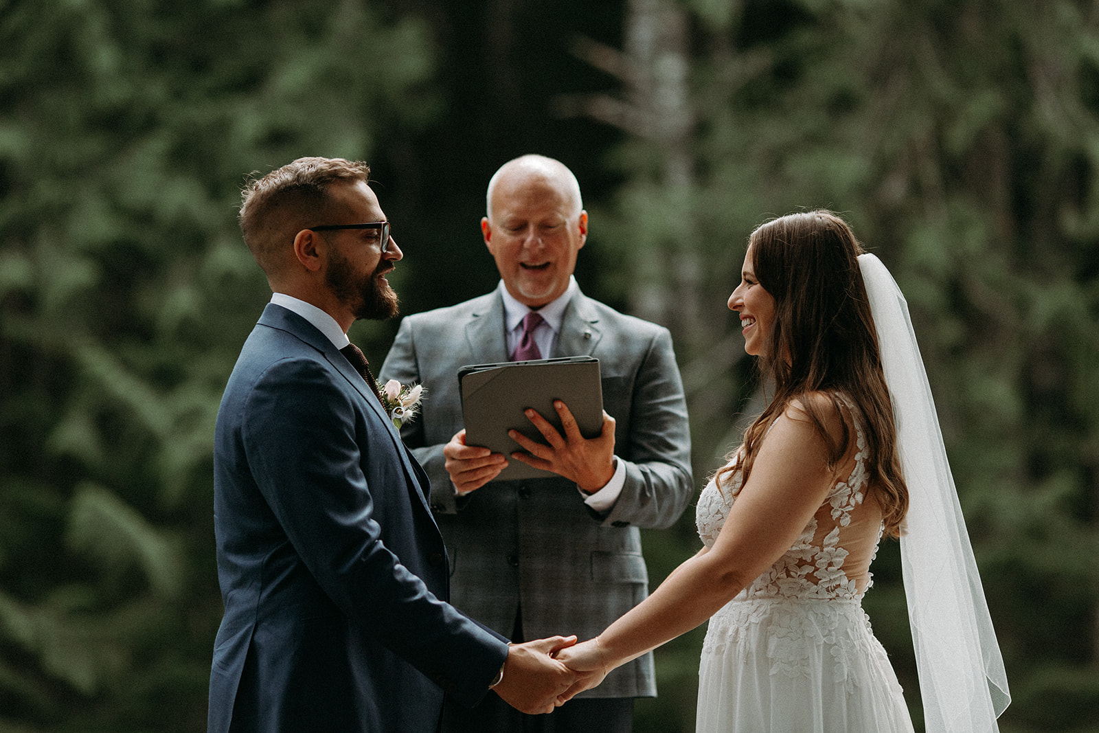 vanouver wedding officiant in grey suit for whistler wedding