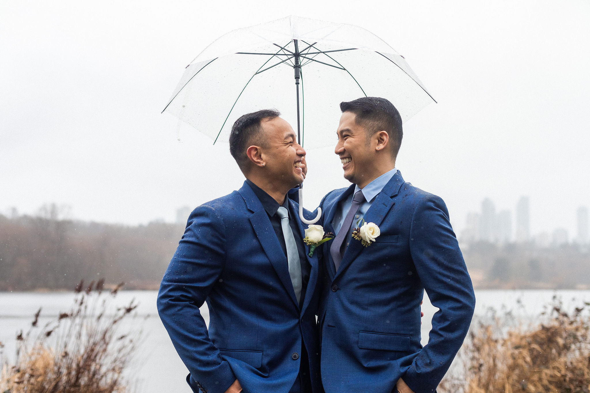 grooms in navy suits at rainy vancouver wedding, queer friendly wedding vendors