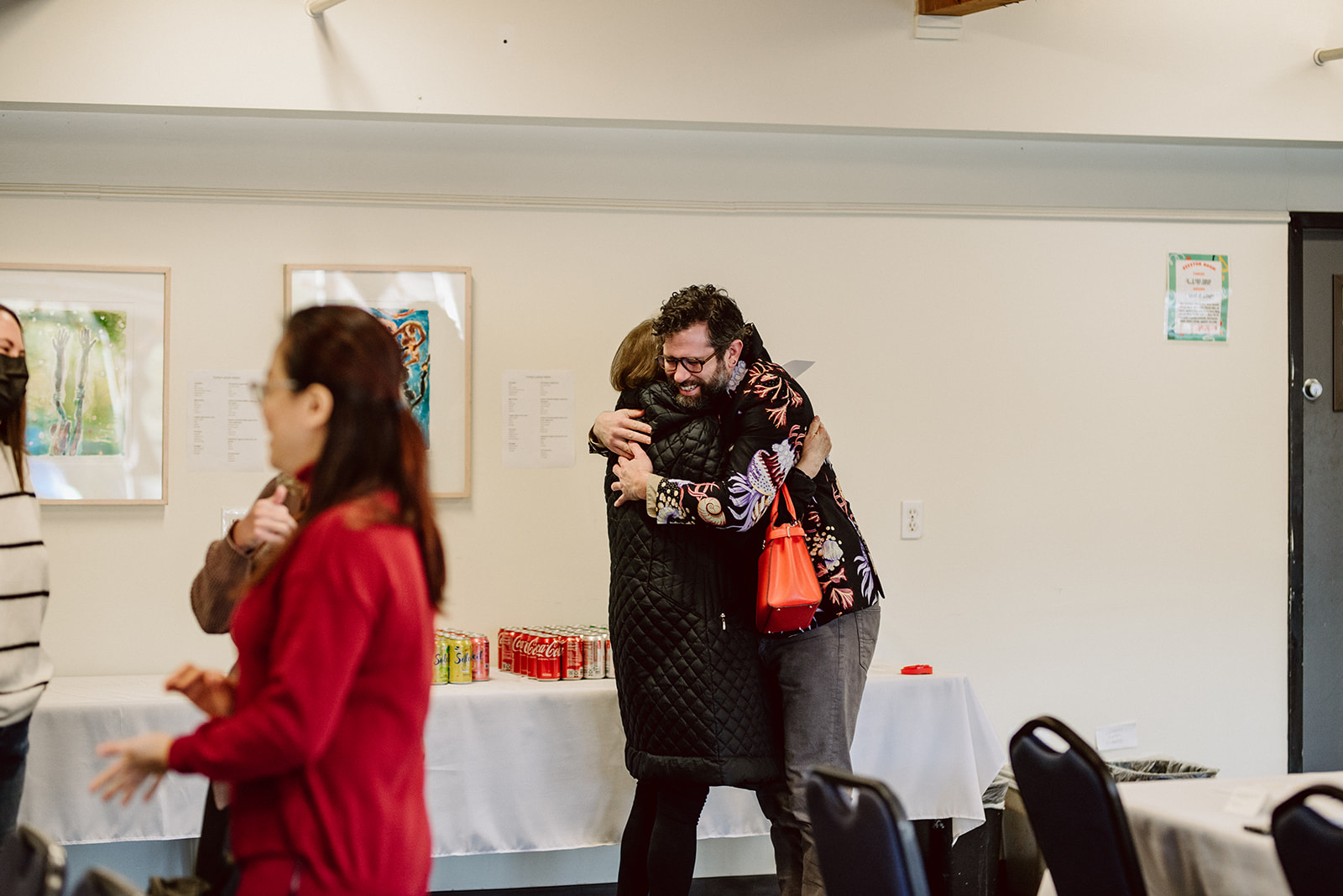 Two vendors hug at the in-person Altared hosted in Portland, Oregon, on December 5, 2022. Photo credit: Venture Ever After