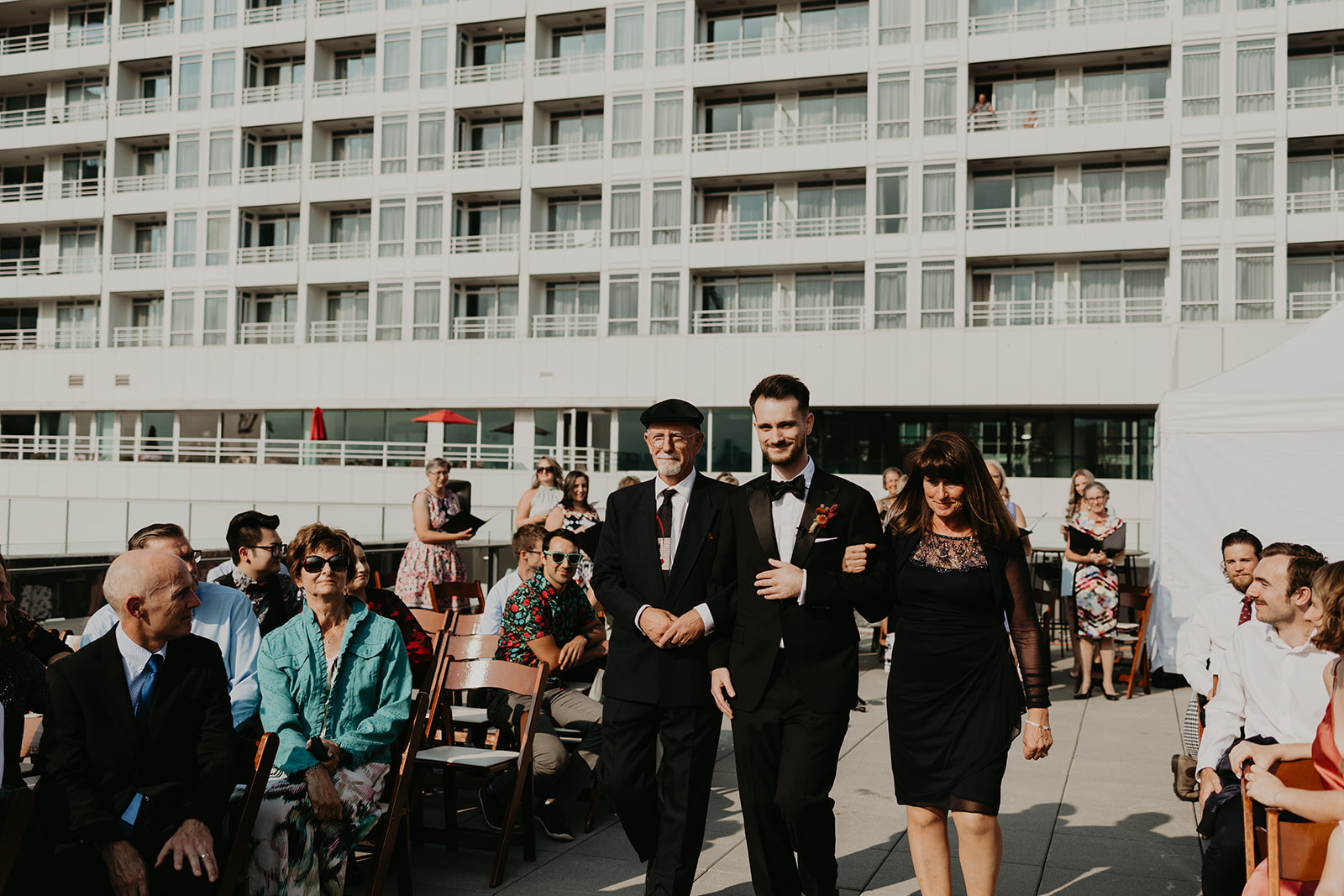 processional alternative, groom walks in with parents, young hip and married wedding ceremony