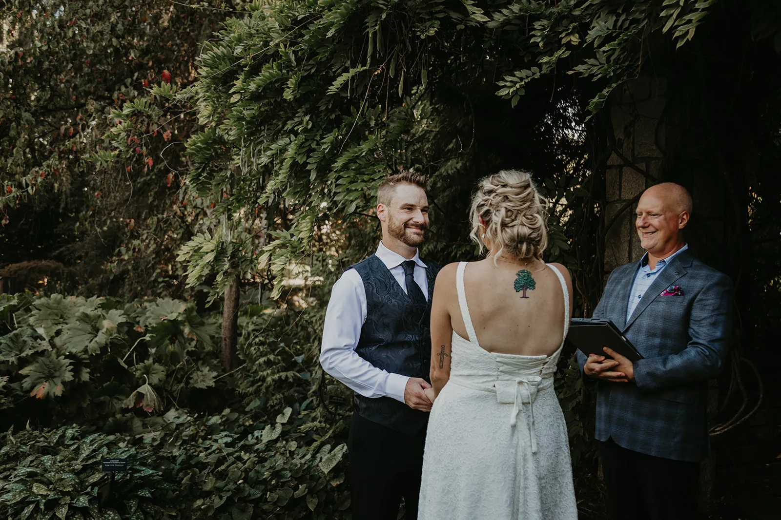 Officiant Lonnie conducting an elopement ceremony in the park
