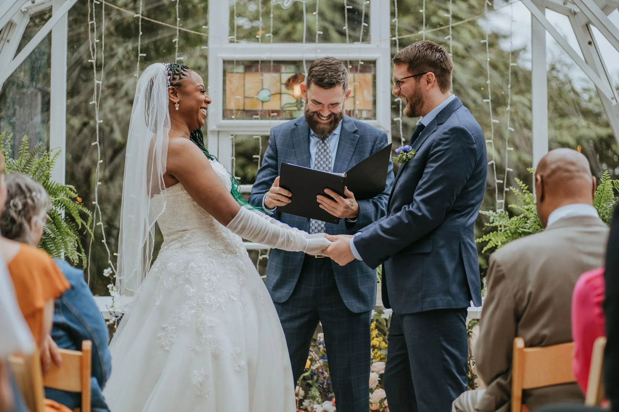 Paula and Jeff laughing at their ceremony with Officiant Curt, Jocelyn Buchart Photography