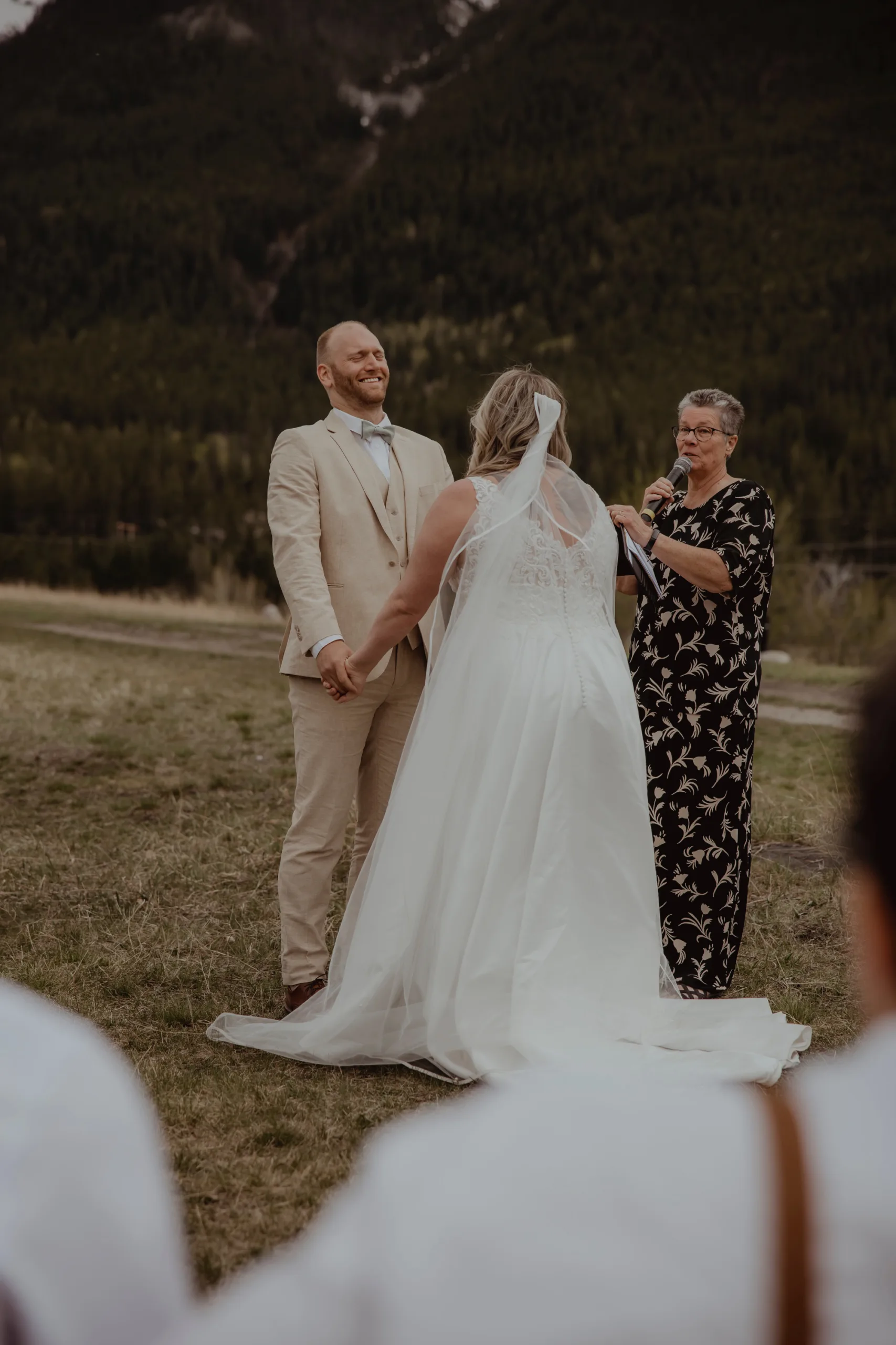 LeAnn officiates an outdoor ceremony for a young couple.