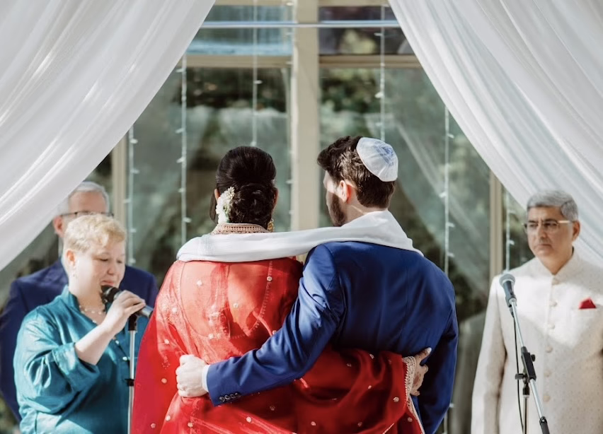 A couple is married by wedding officiant Shira Stanford-Asiyo